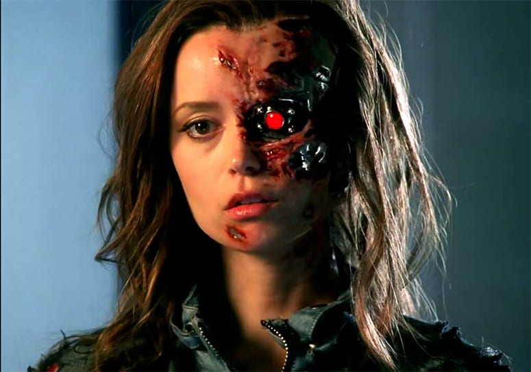 Actress Summer Glau as a terminator, with machinery exposed in her face. 