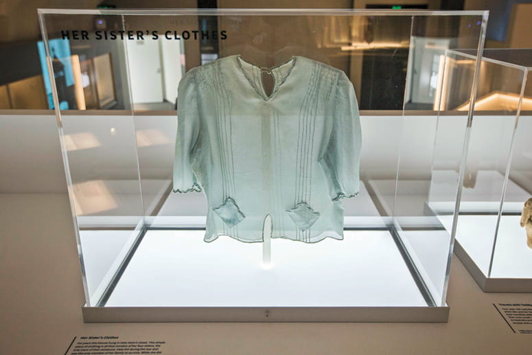 Photo of a blouse on display in the Remnants exhibit