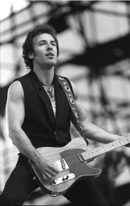 Photo of Bruce Springsteen performing