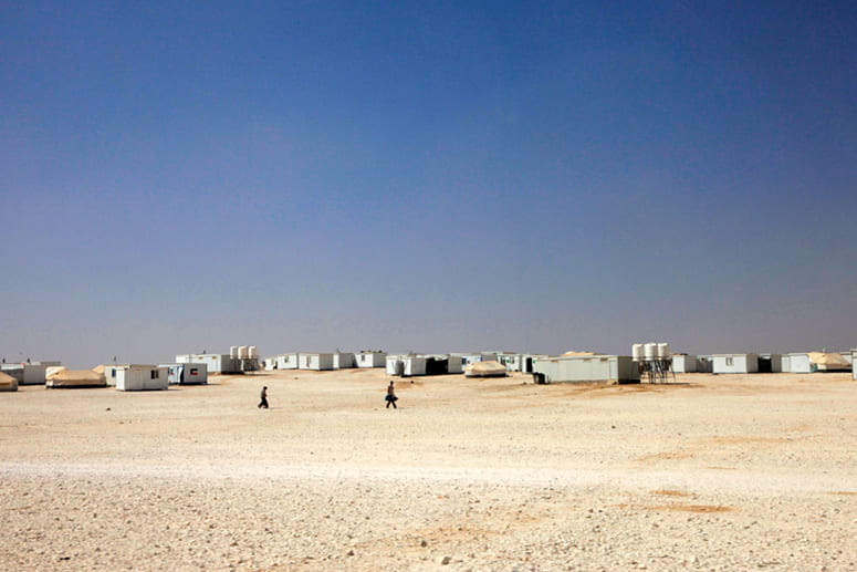 Photo of refugee camp temporary buildings in desert