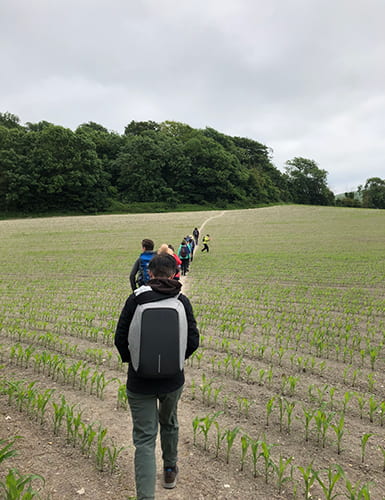 Group of people walking through a field