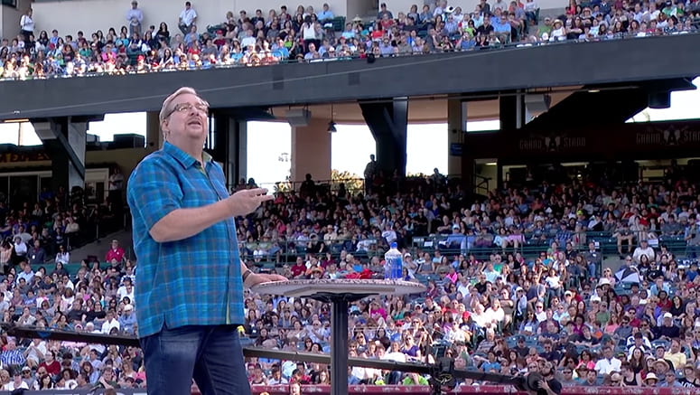 Pastor Rick Warren speaking to a large crowd