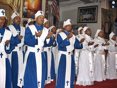 Photo of a church choir singing and clapping