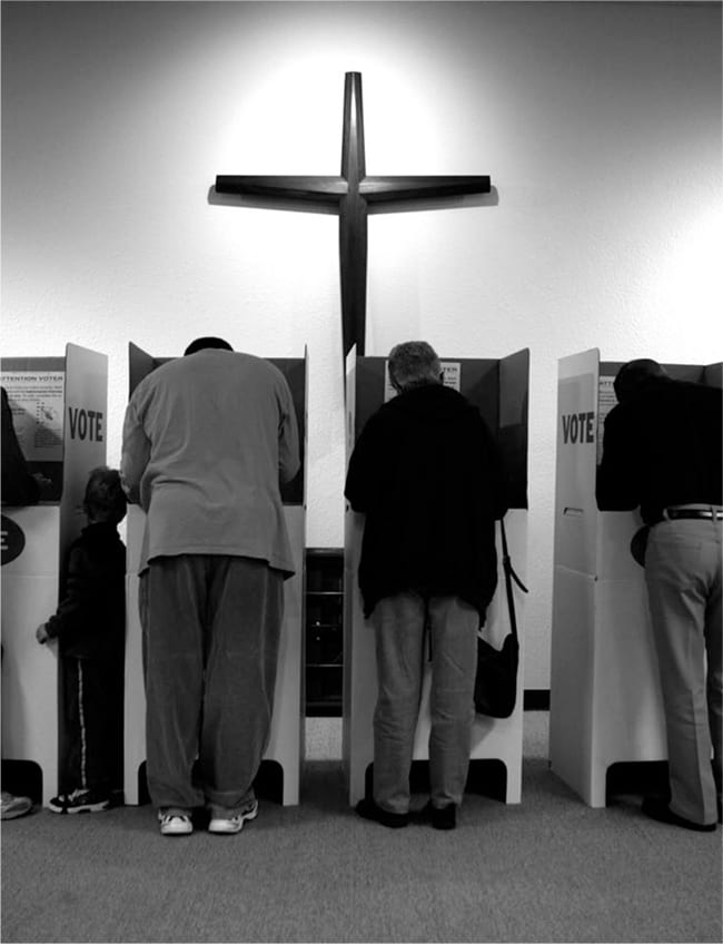 Voting booths under a church's cross