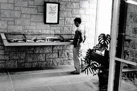 Student at the entrance to the Andover-Harvard Theological Library