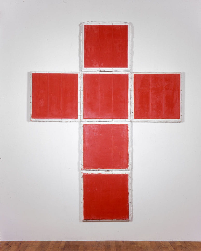 Photo of a series of red squares showing the cross-like shape of an open cube