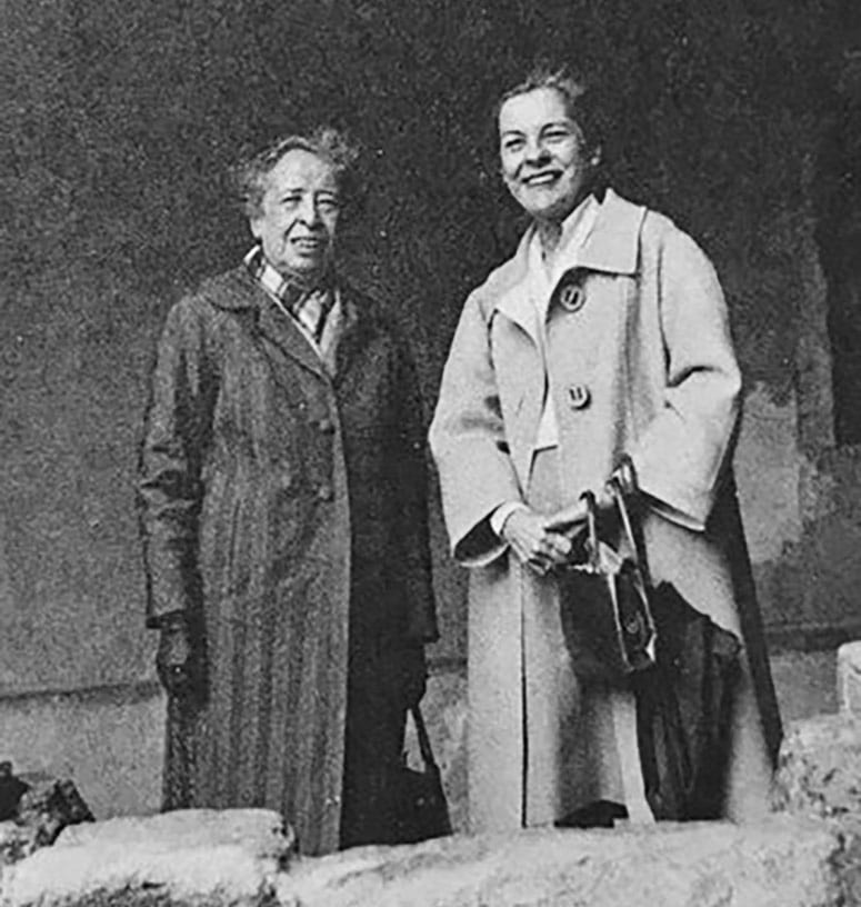 Historic photo of two women standing outside