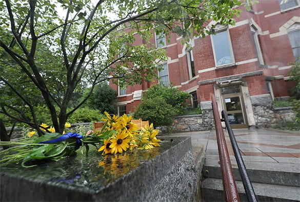Flowers laying next to the entrance steps to Shaloh House