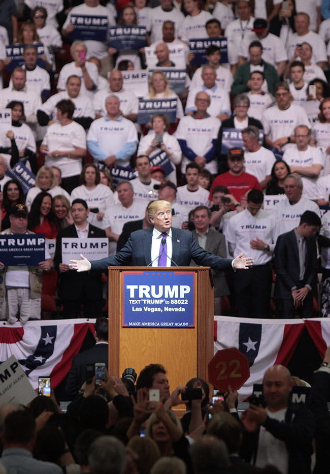 Donald Trump at a podium during a 2016 campaign rally