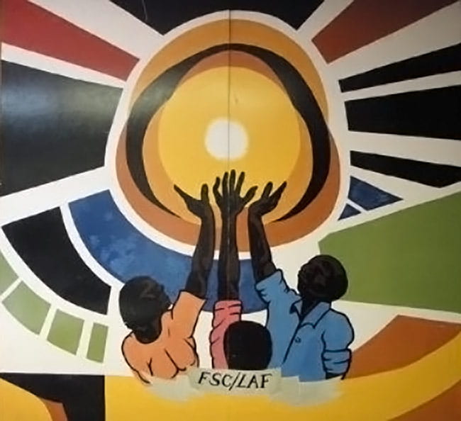 three Black figures reaching up together to hold the sun