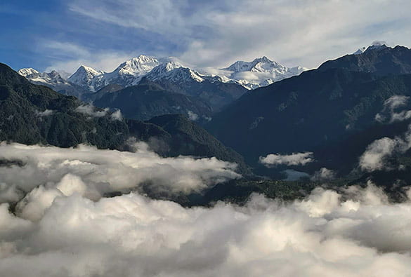 Himalayan mountains rising above the clouds